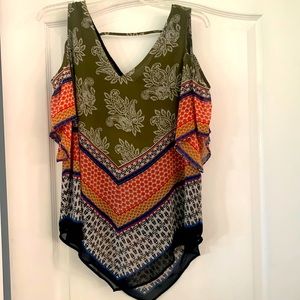 DR2 Small neutral tone cold shoulder triangle style top with sheer black lining.